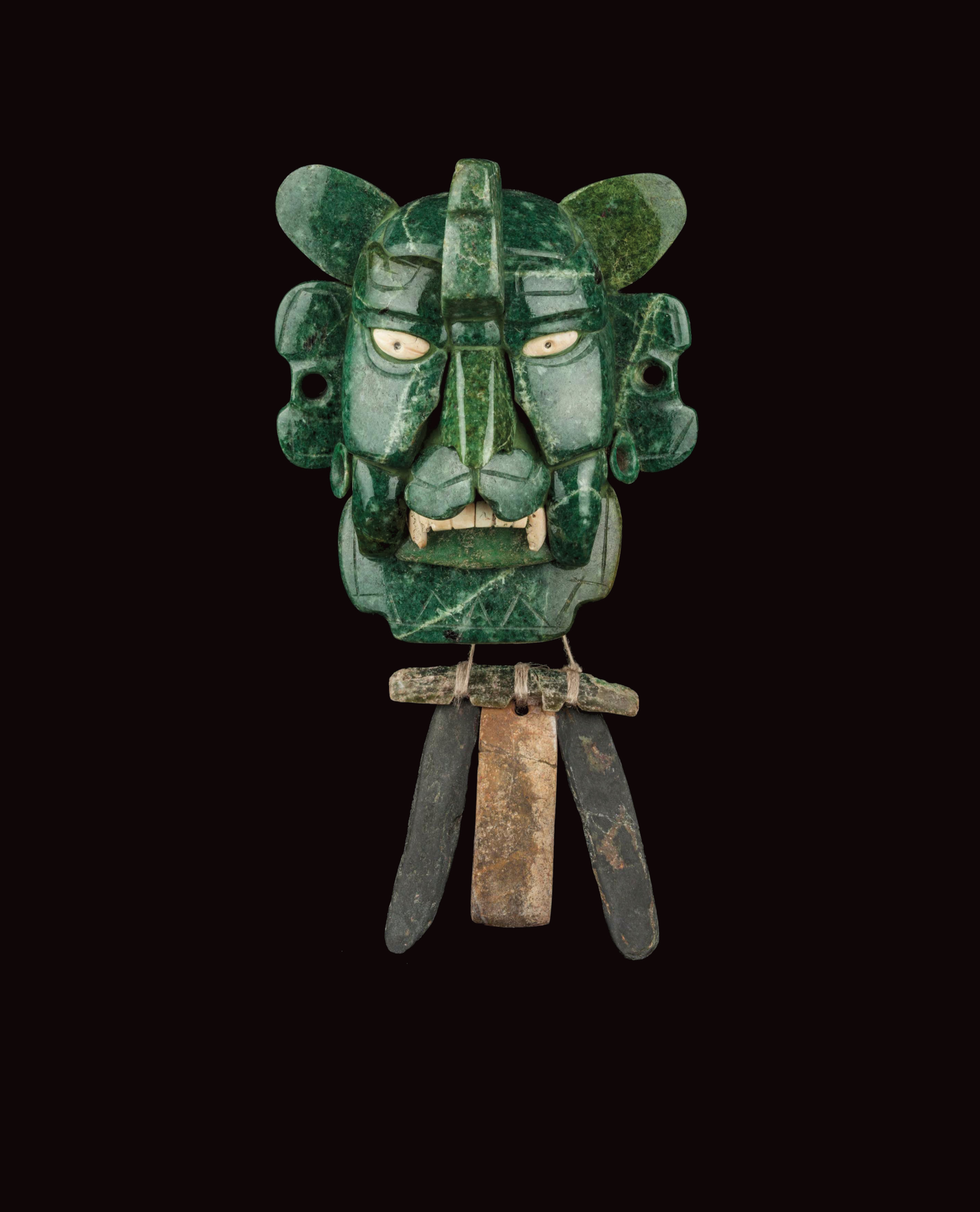  A Zapotec vampire bat mosaic mask made of 25 pieces of jade, with yellow eyes made of shell. Photo by Adrian Hernandez, licensed under cc by-sa 4.0.