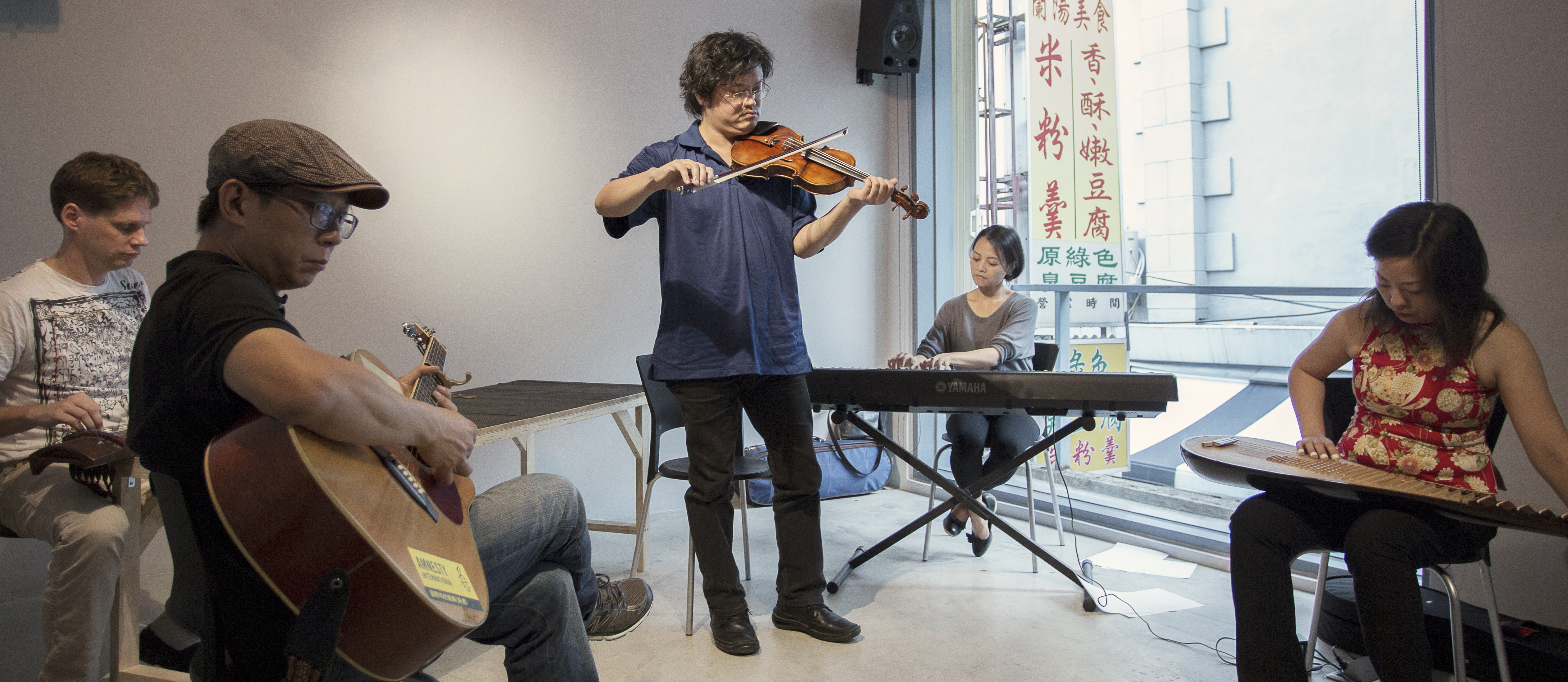 Hong-Kai Wang, "The Broken Orchestra Live in Taipei" (2012), collaborative performance in which musicians reinterpret the artist’s childhood recording of Bach’s “Ave Maria” through open rehearsal and improvisation. TheCube Project Space, Taipei, Taiwan. Photo: Chen You-Wei.