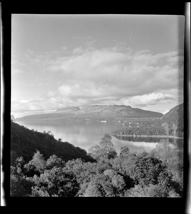 View over Lake Tarawera to Mount Tarawera from bush-covered shoreline, Rotorua, Bay of Plenty, 1946. Photograph by Whites Aviation.