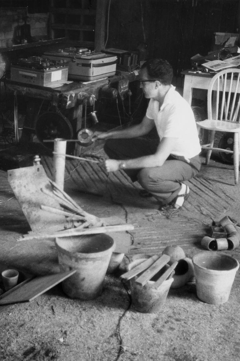 Douglas Lilburn recording sounds in a barn, Wiltshire, England - Photograph taken by Peter Russell Crowe