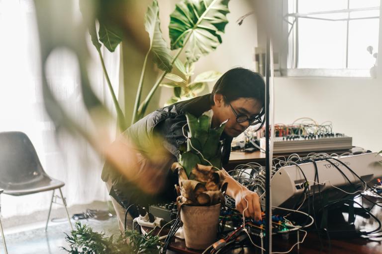 Nick Tsai in his Taichung studio working on his Plant Sonification project, 2025. 