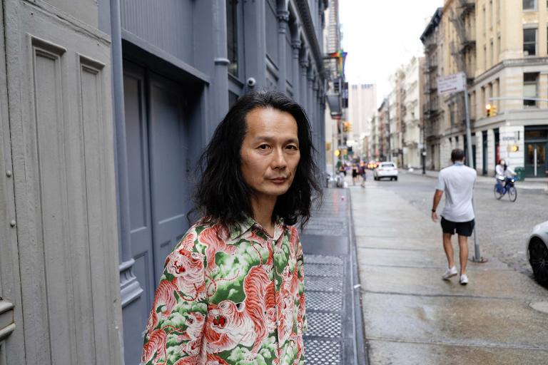 Aki Onda standing in front of Nam June Paik's loft, SoHo, New York, 2019. Photo Maki Kaoru.